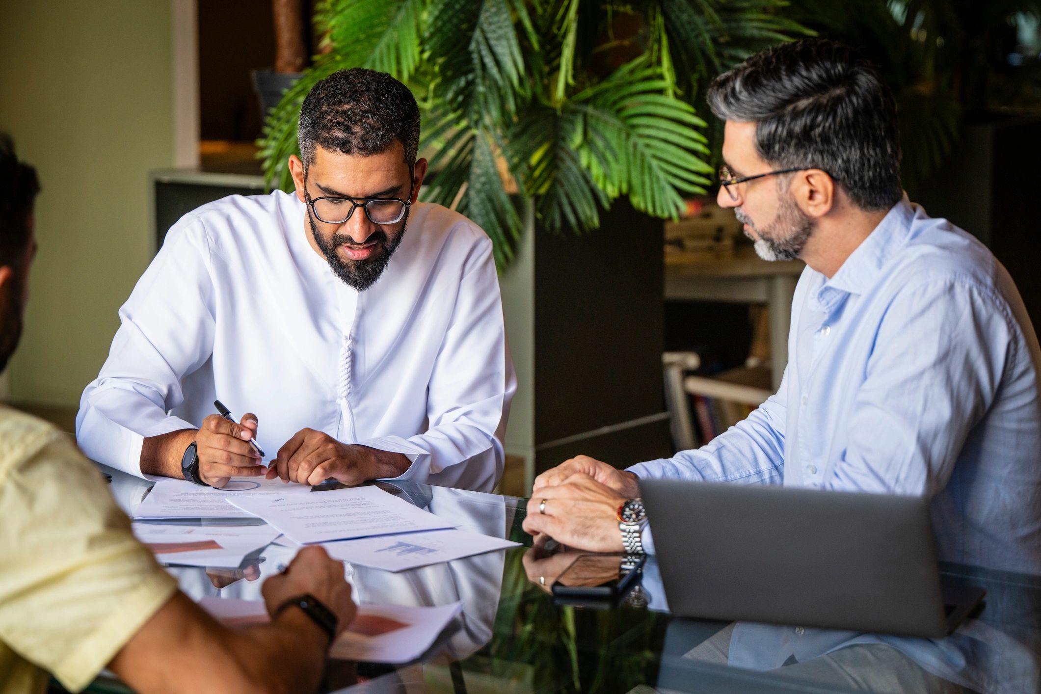 Consulting meeting with documents and policy materials on the table