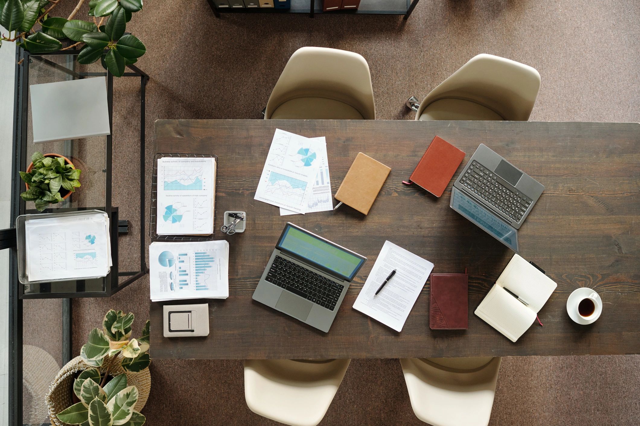 Policy research workspace with laptops and documents